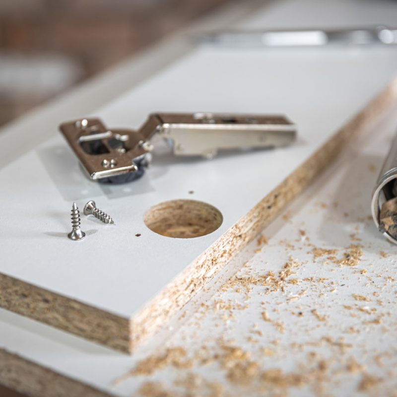 Close-up of a self-tapping screw, wood screw in the carpenter's craft.